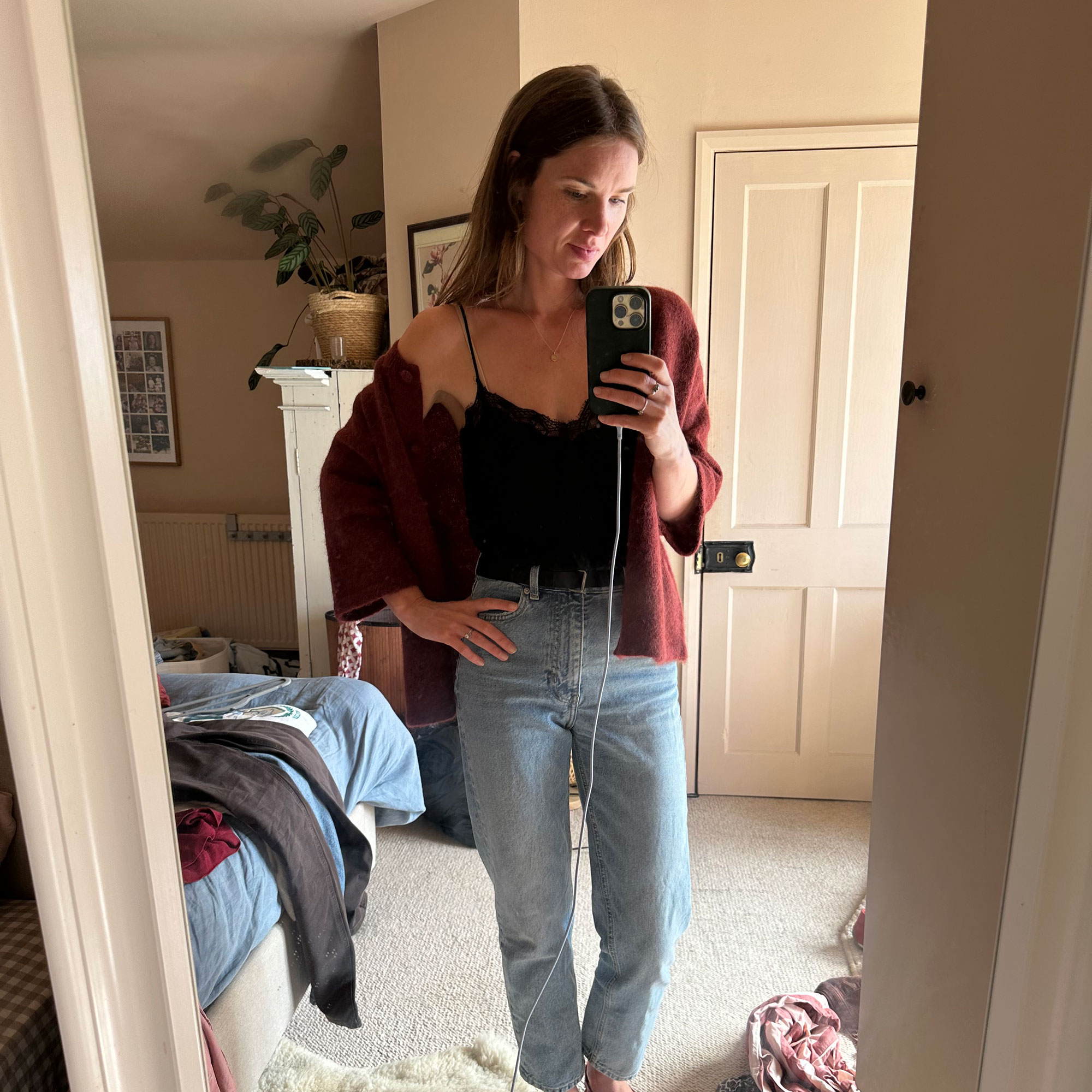 Woman taking selfie in mirror