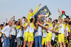 UAE Team Emirates celebrate winning the GC and team prize at the 2024 Tour de France