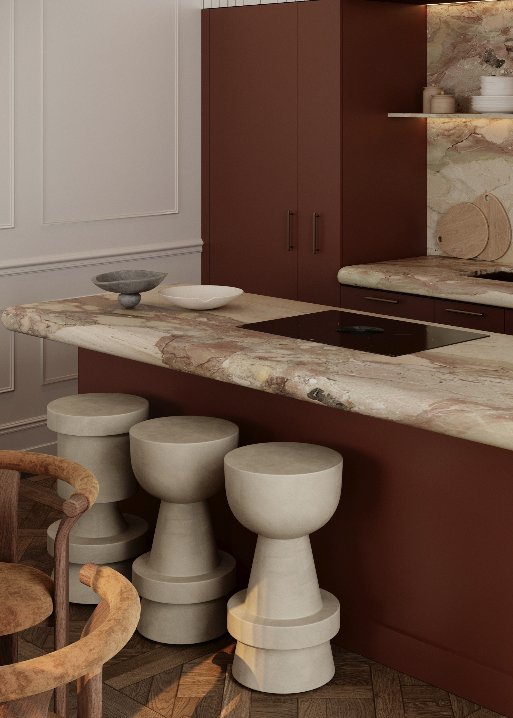 A modern traditional terracotta kitchen with a think slab of stone for the countertop with a curved profile, greige round and sculptured bar stools and terracotta cabinetry