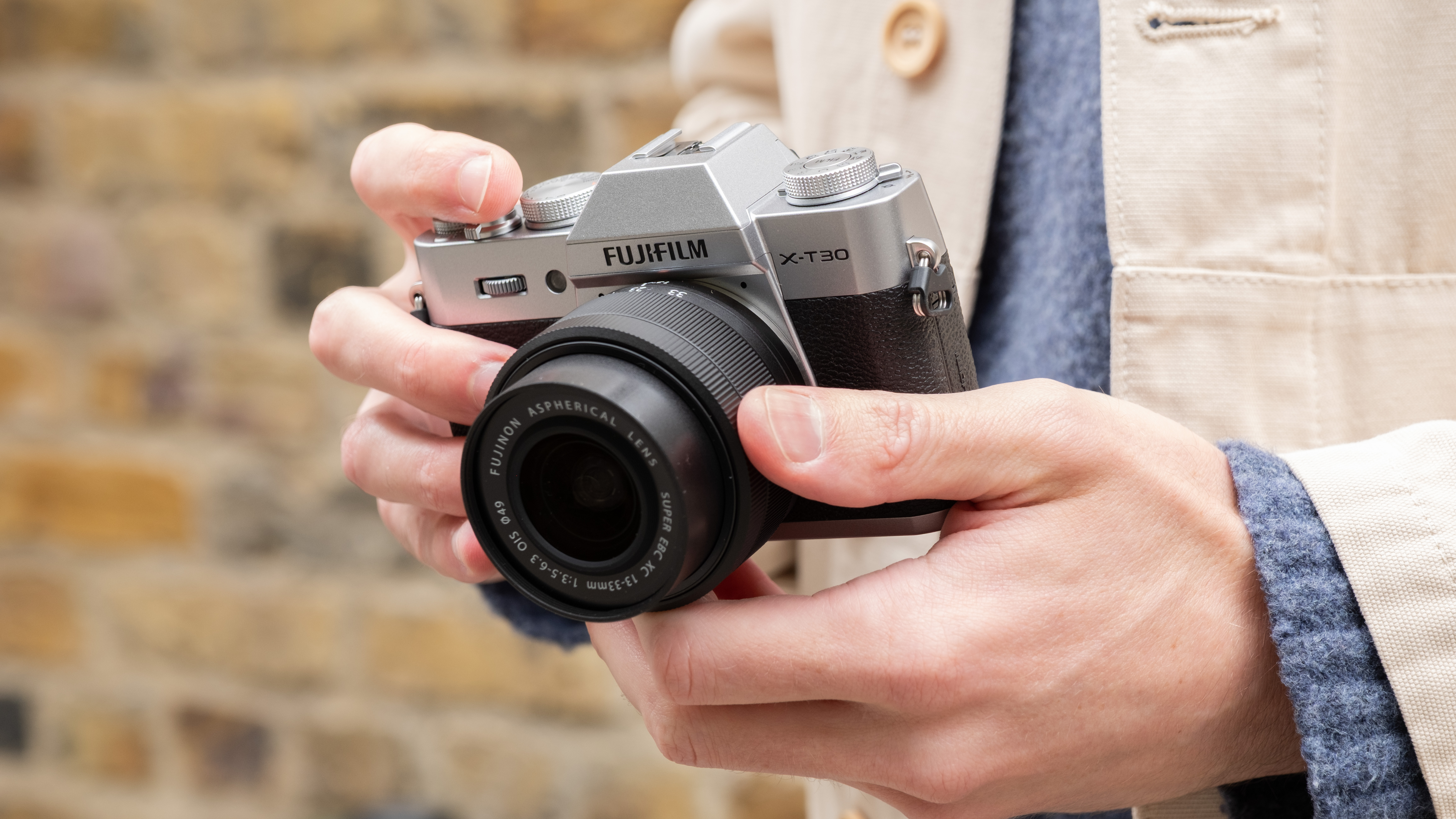Fujifilm X-T30 III camera held in a pair of hands