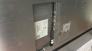A close up of the rear of the Samsung QE55Q60B TV showing the ports at the back.