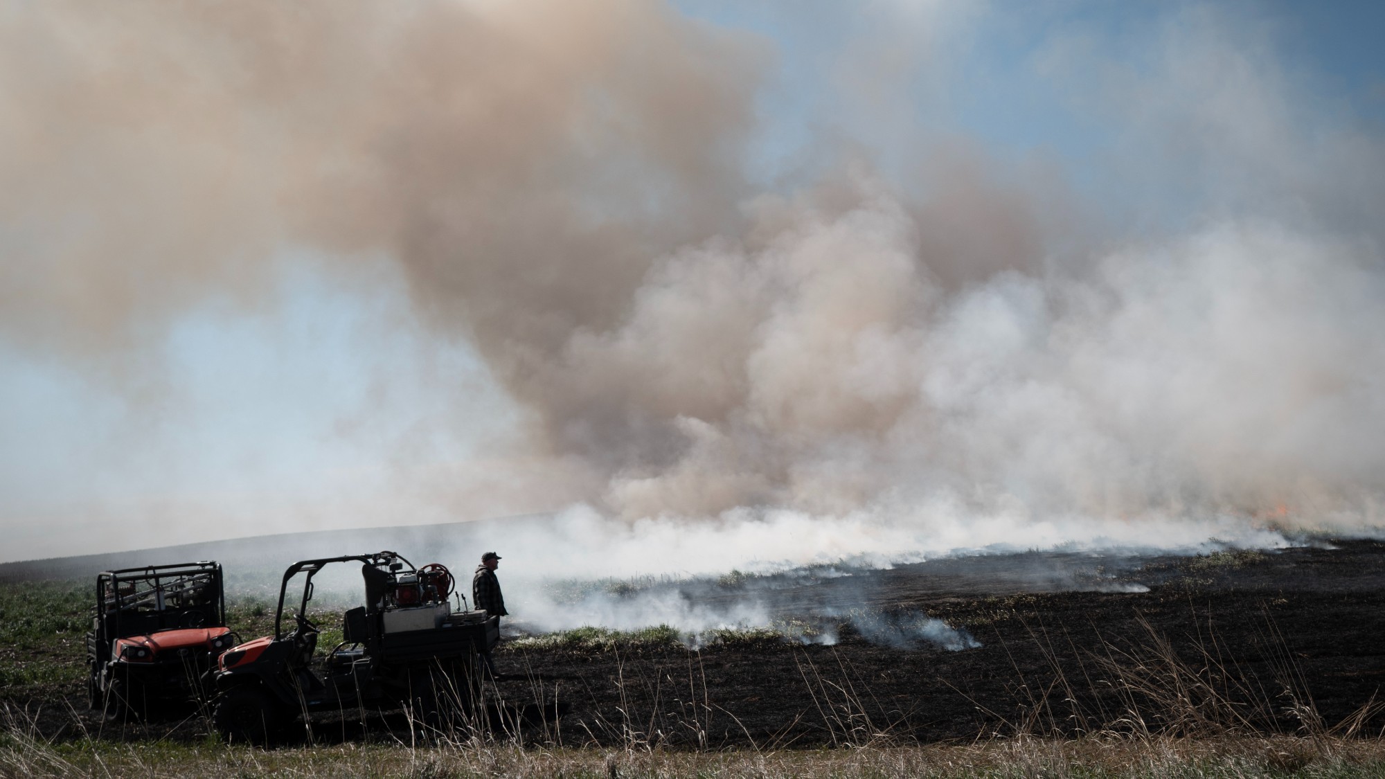 Workers burn Conservation Reserve Program (CRP) ground on a farm on May 06, 2026 near Humboldt, Iowa. 
