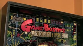 A shot of a pinball machine called Gang Busters in Dawn Of The Dead