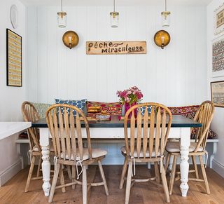 shabby chic kitchen with table chairs and bench seating