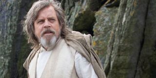 Luke Skywalker with long hair and a beard on his island.