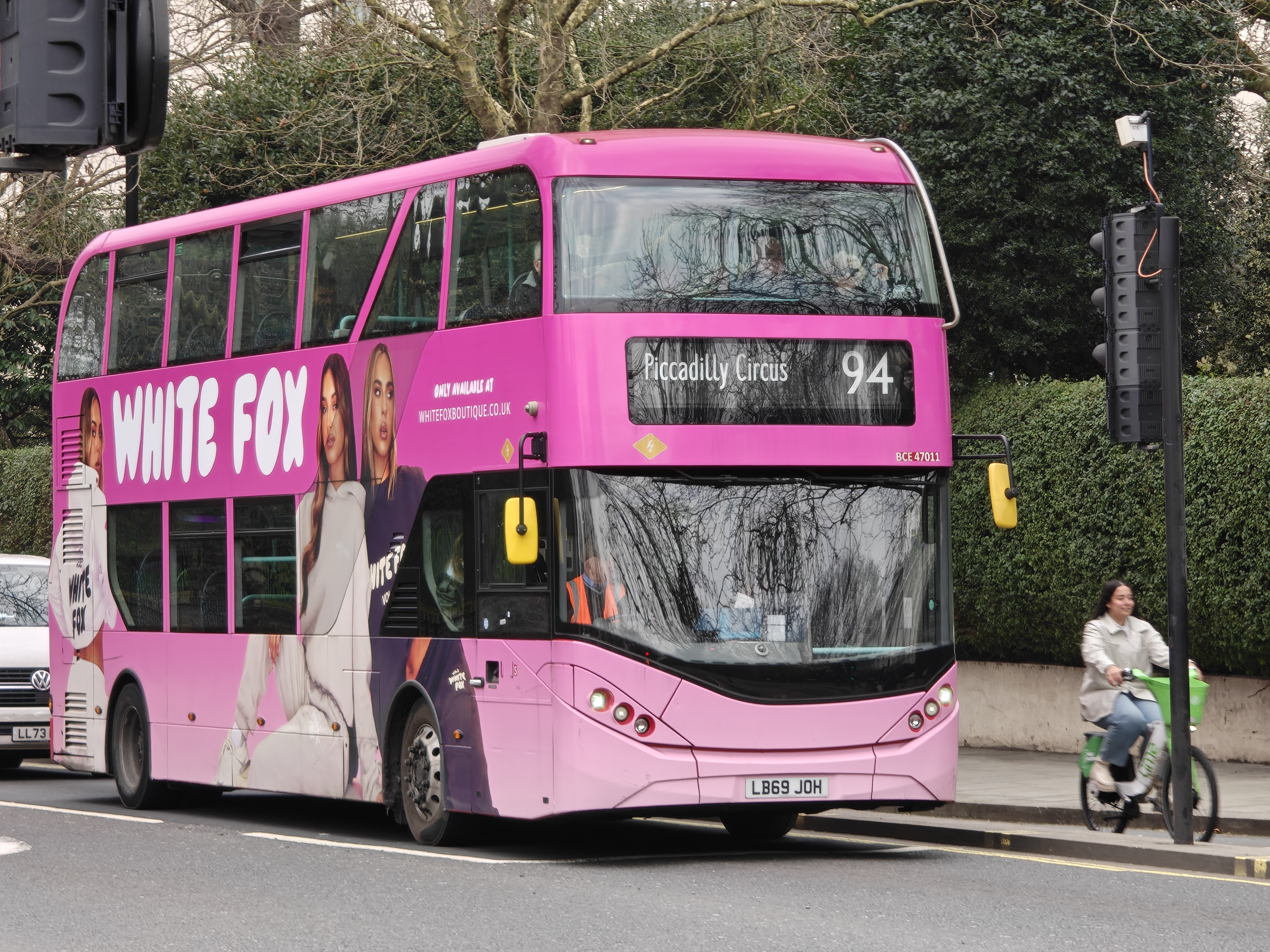 A London bus wrapped in pink advertising