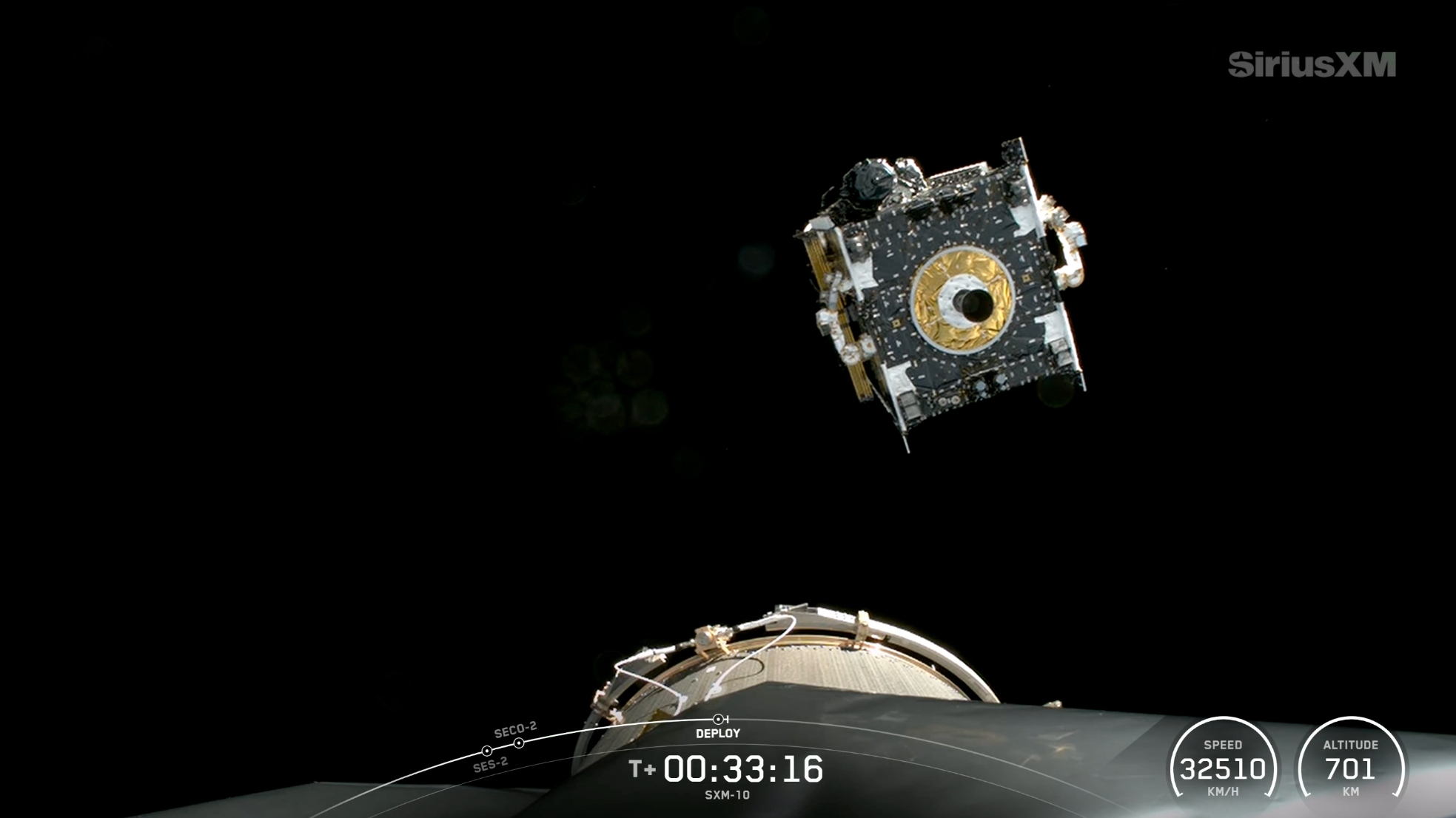 a boxy satellite deploys from its rocket's upper stage in earth orbit