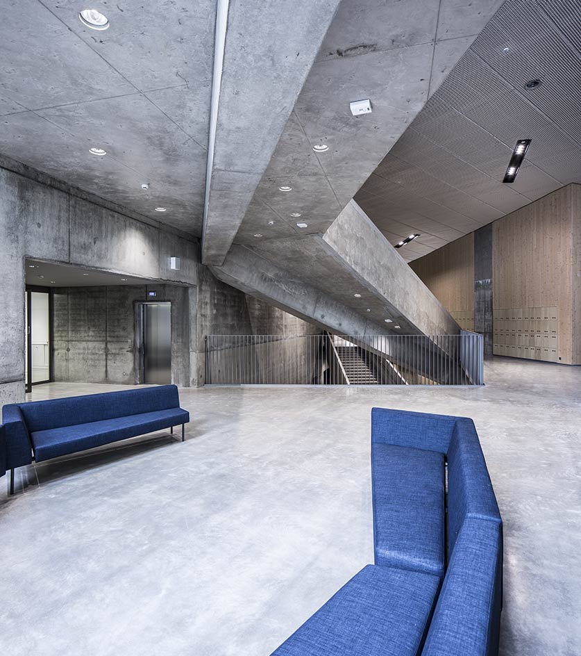 A view of a building inside sofas and stairs