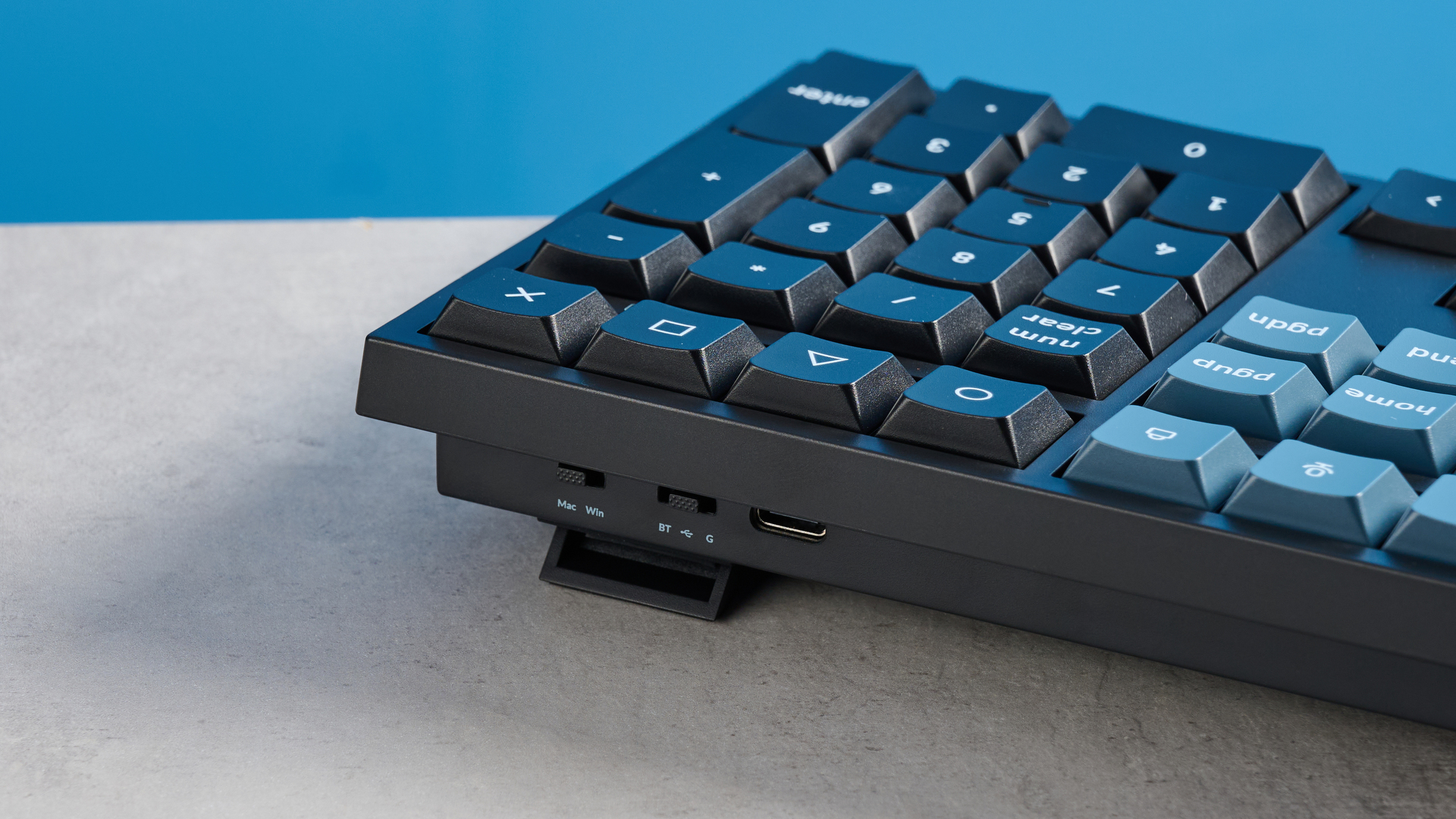 Keychron B36 keyboard and Keychron BM25 mouse photographed in front of a blue background.