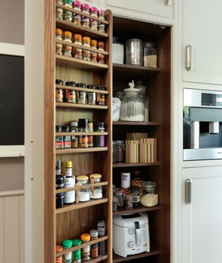 kitchen pantry with glass jars in kitchen shelves