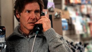 harrison ford on a pay phone in a still from the movie the fugitive