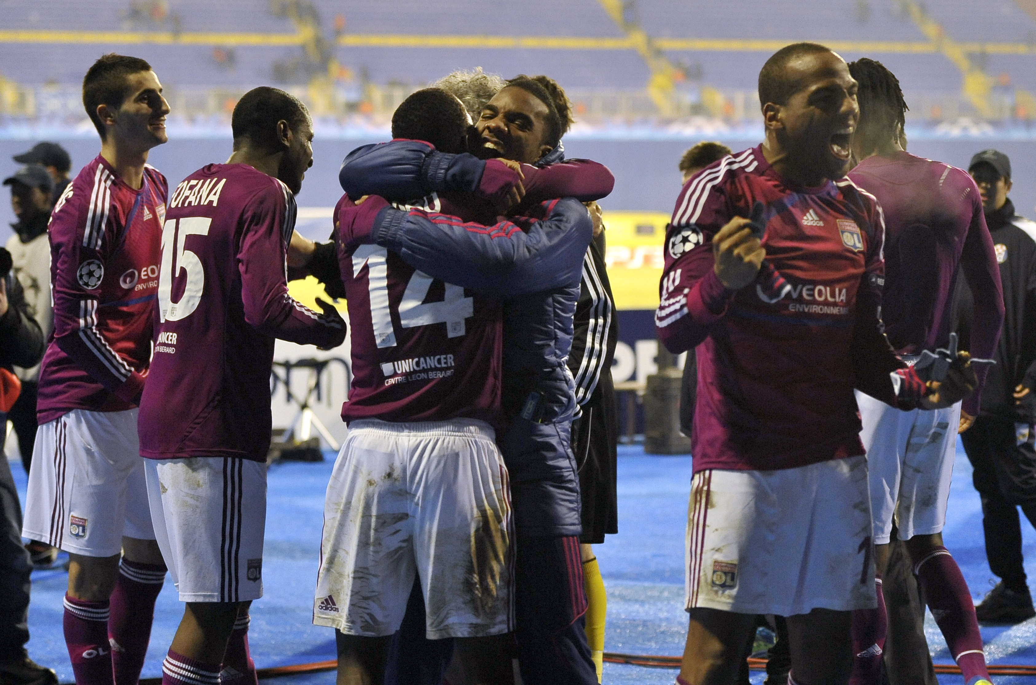 Lyon players celebrate their 7-1 win at Dinamo Zagreb in the Champions League in December 2011.