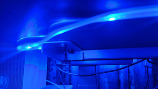 Nanoleaf Essentials Matter Lightstrip set-up on a desk.