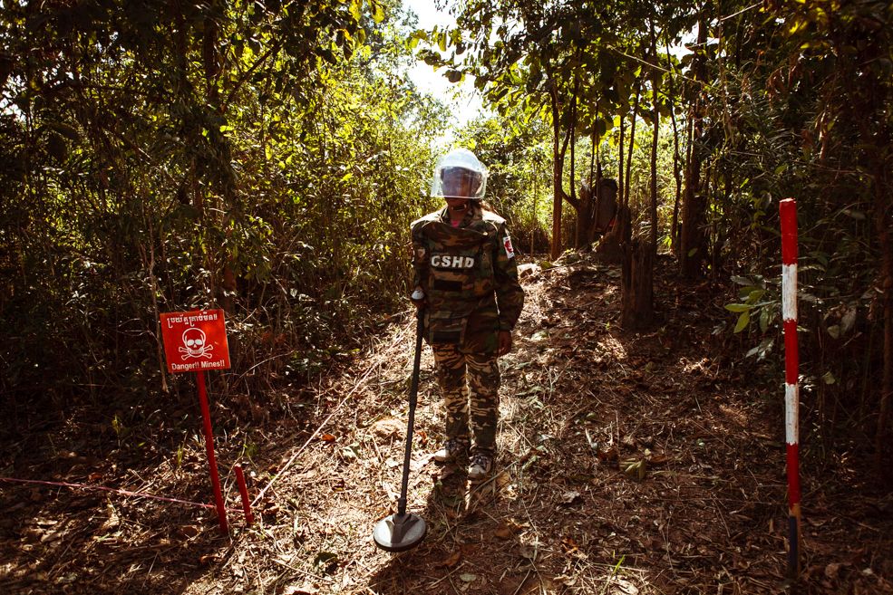 A member of the CSHD team walks away from an area she was clearing for the night. Villages are chosen on a case by case basis.