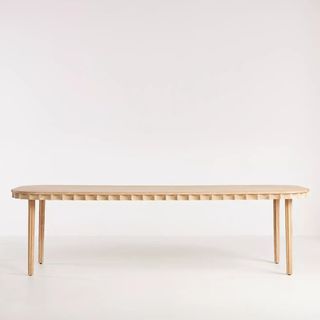 Anthropologie Norma Dining Table against a white background.