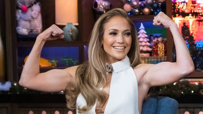 Jennifer Lopez displays her toned, muscly arms as she flexes her biceps