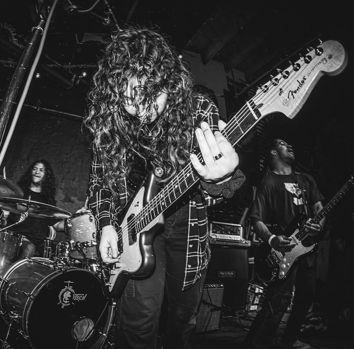 Fleshwater band, with the guitarist in focus