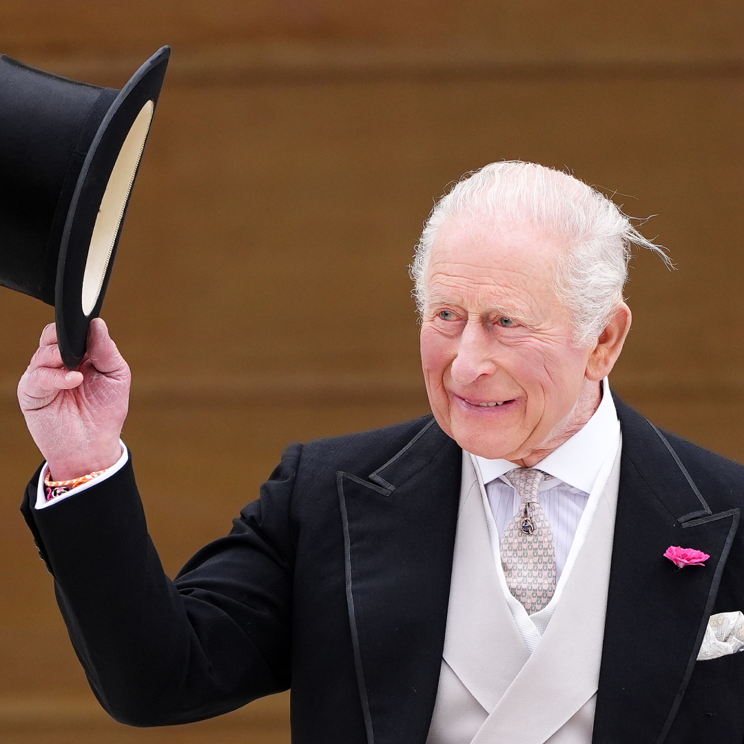 King Charles tipping his top hat
