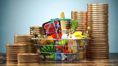basket of food surrounding by stacks of gold coins