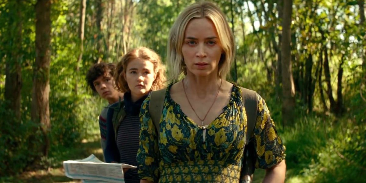 Marcus, Regan and Evelyn Abbot walk through the woods in A Quiet Place Part II