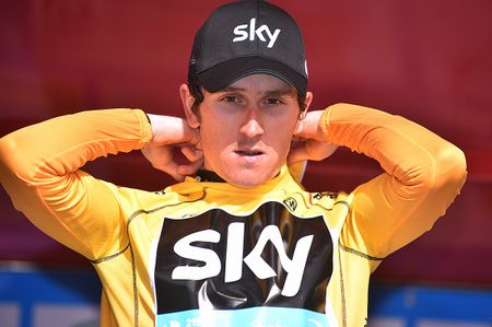 Geraint Thomas adjusts the yellow jersey