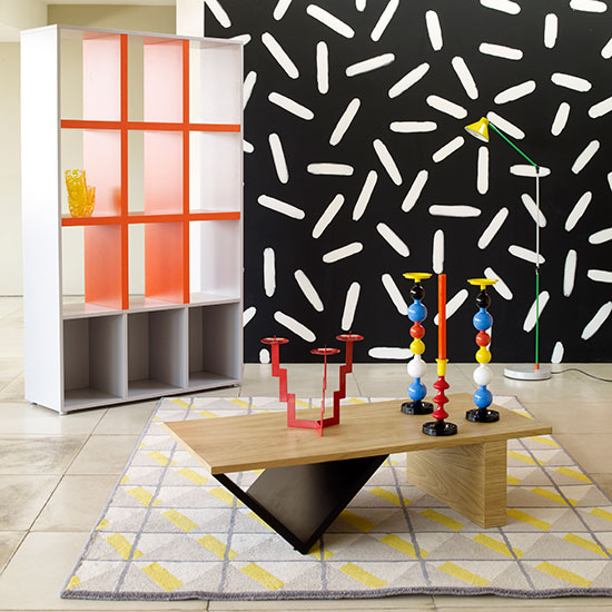 oxo shelving unit wooden graphic piece and black designed wall