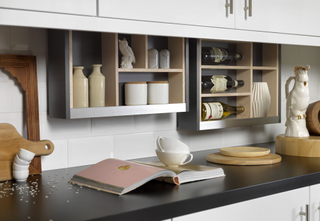 kitchen shelves that pull down behind the cabinets for extra storage