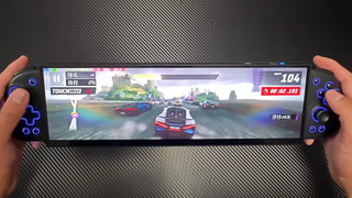 We see an ultrawide, 32:9 aspect ratio DIY handheld gaming machine playing a racing game.