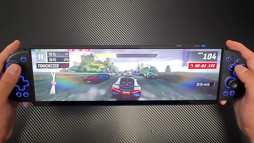We see an ultrawide, 32:9 aspect ratio DIY handheld gaming machine playing a racing game.