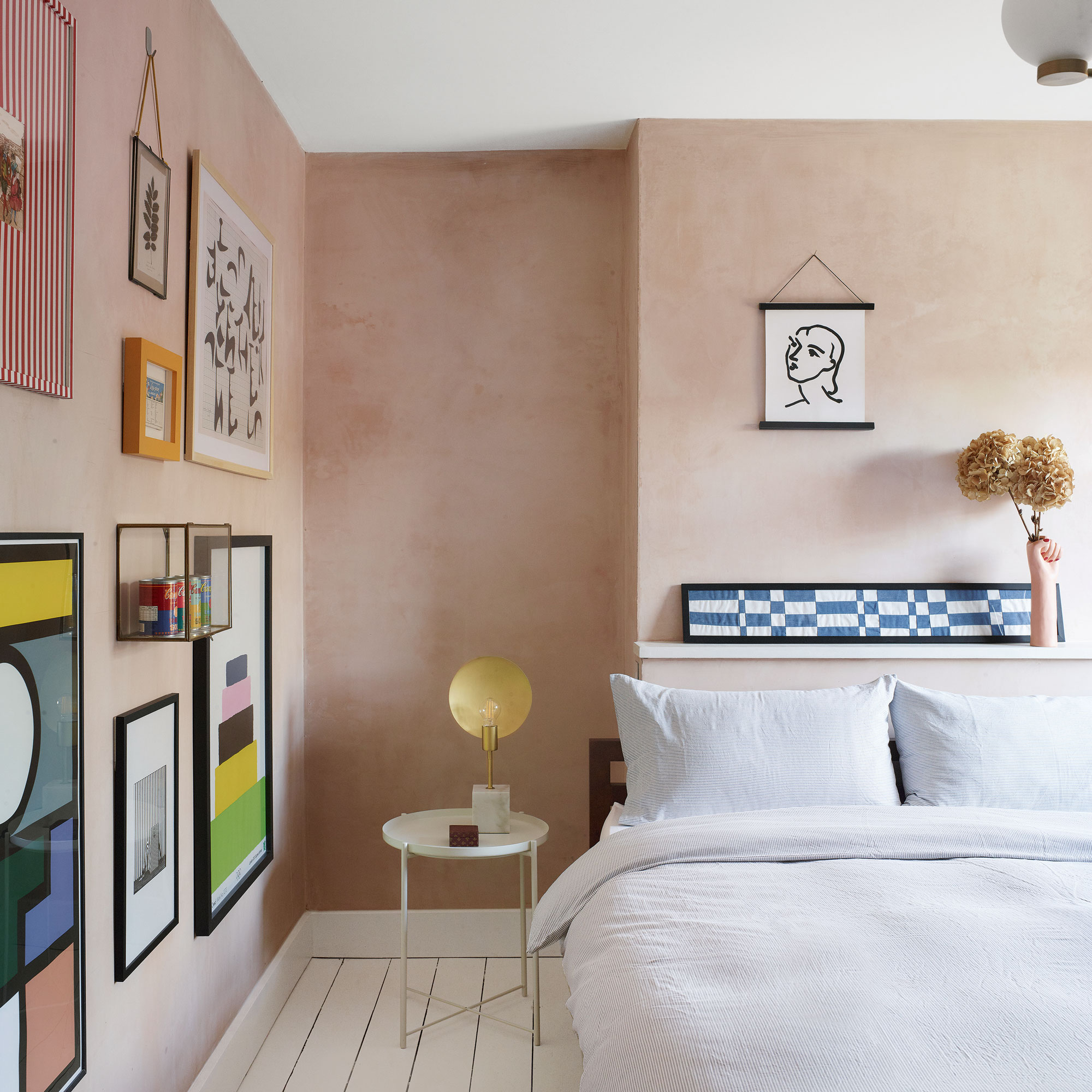 Pink bedroom with gallery wall