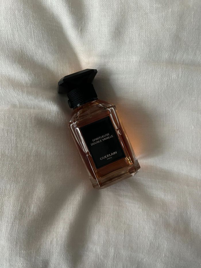 A picture of Guerlain Spiritueuse Double Vanille on a white linen background