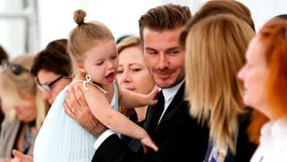 Harper Beckham and David Beckham at NYFW