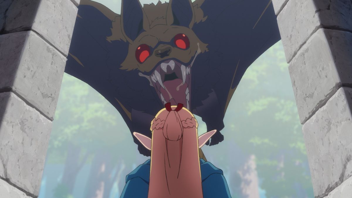 A giant bat swoops down, mouth open, at Marcille in a still from the fantasy Netflix anime, &quot;Delicious in Dungeon&quot;