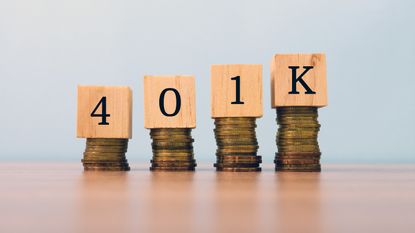 401k is spelled out on top of four stacks of coins that get progressively higher.