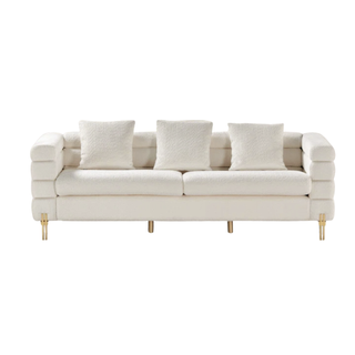 white boucle sofa with gold legs
