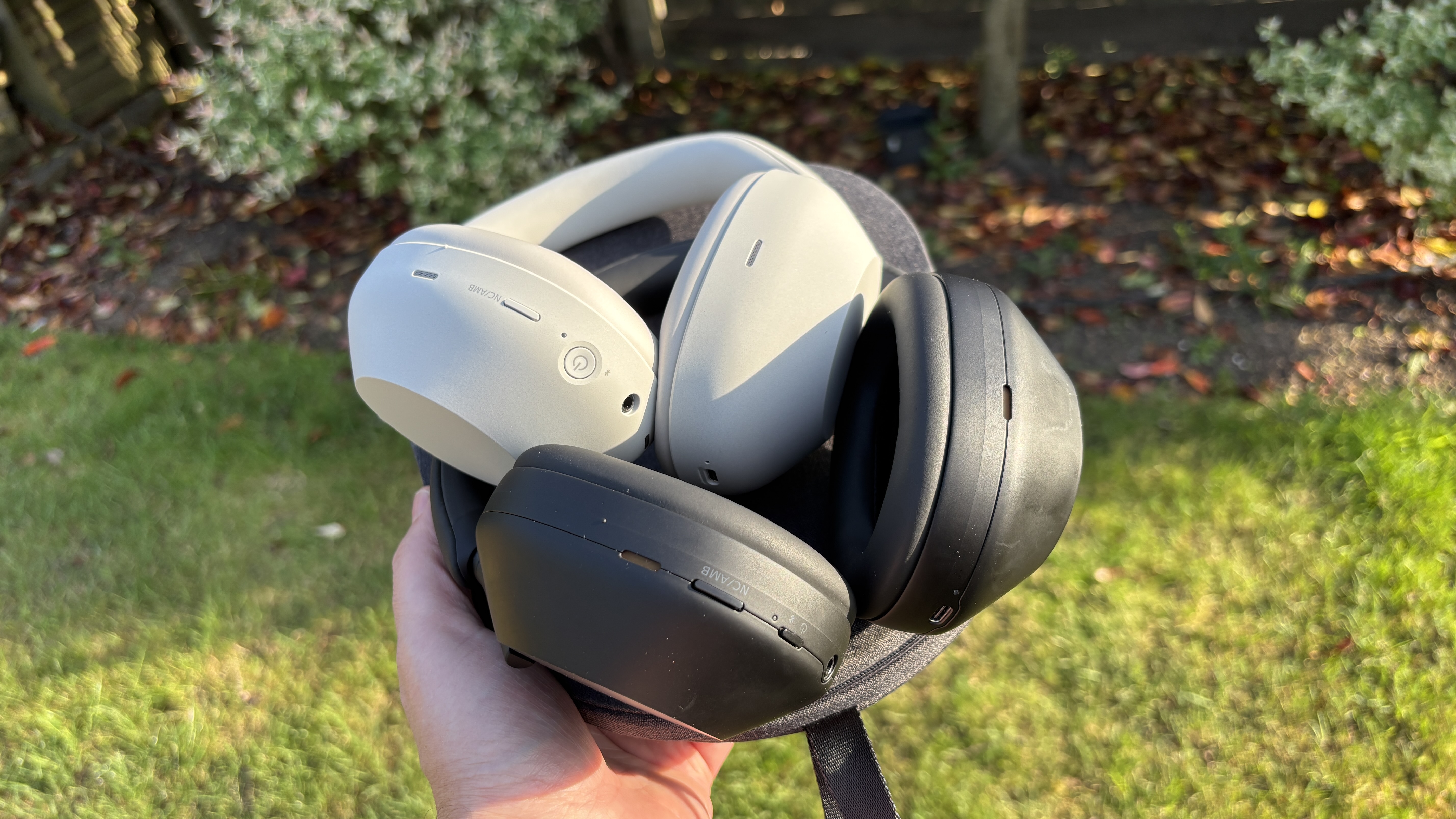 Sony WH-1000XM6 and WH-1000XM5 on top of each other, showing differences in earcup design