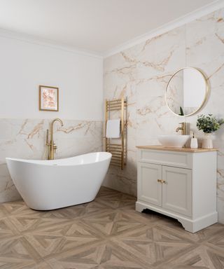 wooden effect parquet flooring in bathroom with white bath and vanity unit
