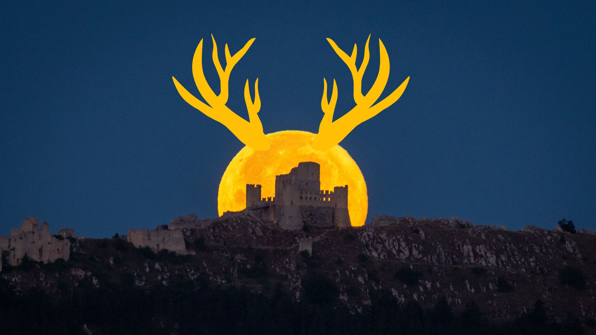 A yellow-orange full moon with antler-like horns rises behind a castle on a hillside in a dark sky.