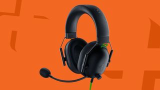 Razer BlackShark V2 X gaming headset on an orange background