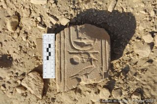 A fragmented bit of stone bearing hieroglyphics found at Gebel el-Silsila.