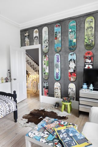 teenage boy bedroom with wallpaper with skateboard pattern