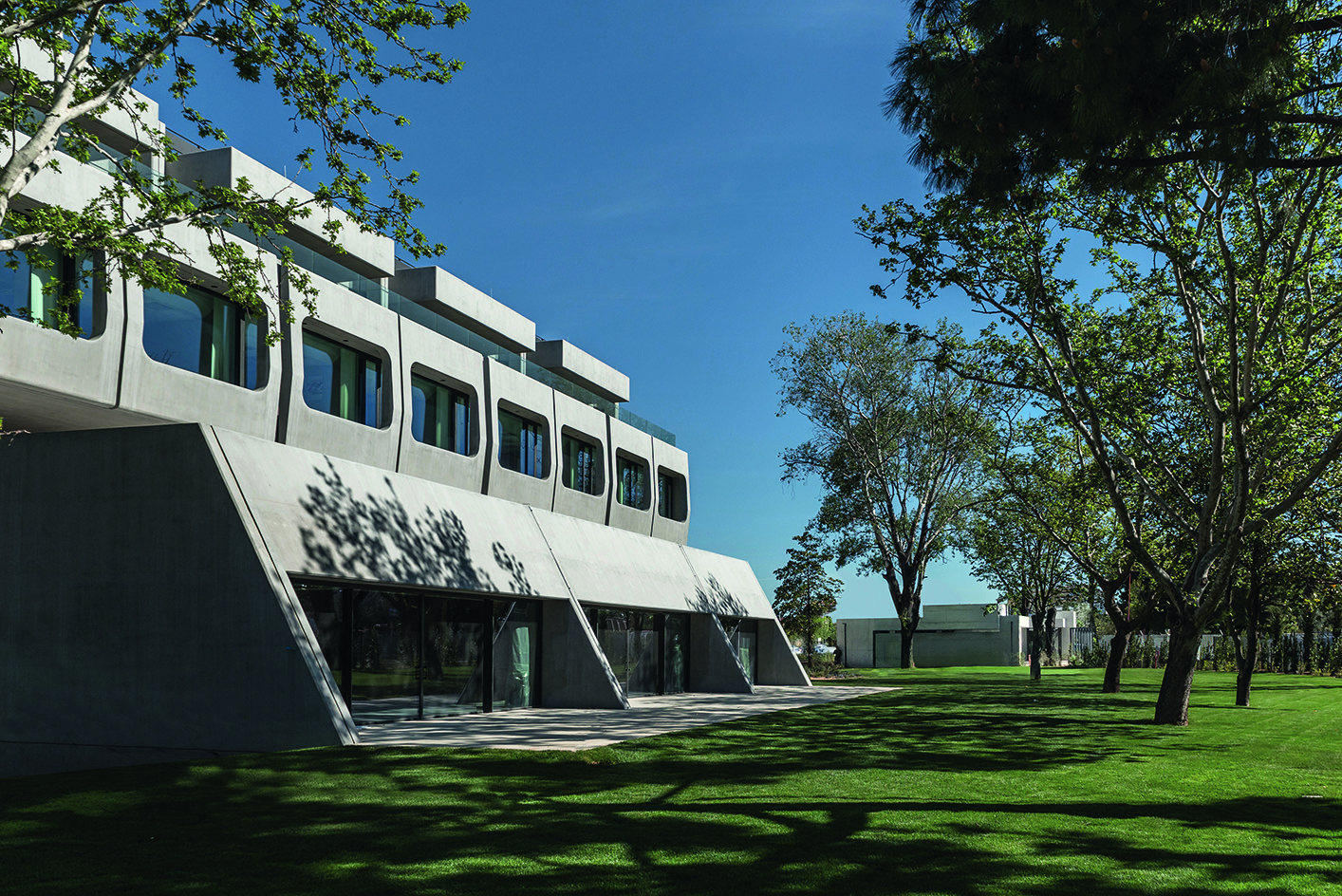 Greek brutalist gem AGET Iraklis by Alexandros Tombazis redesigned by Georges Batzios, clean concrete and marble and stone surfaces and shapes