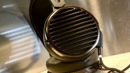 Fiio FT7 headphones on a shelf, showing the grille