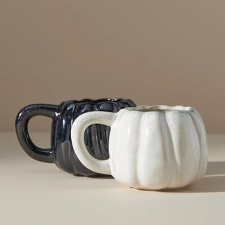White and black pumpkin-shaped mug