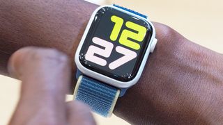 Close-up of the Apple Watch Series 5 in white ceramic on a user's wrist