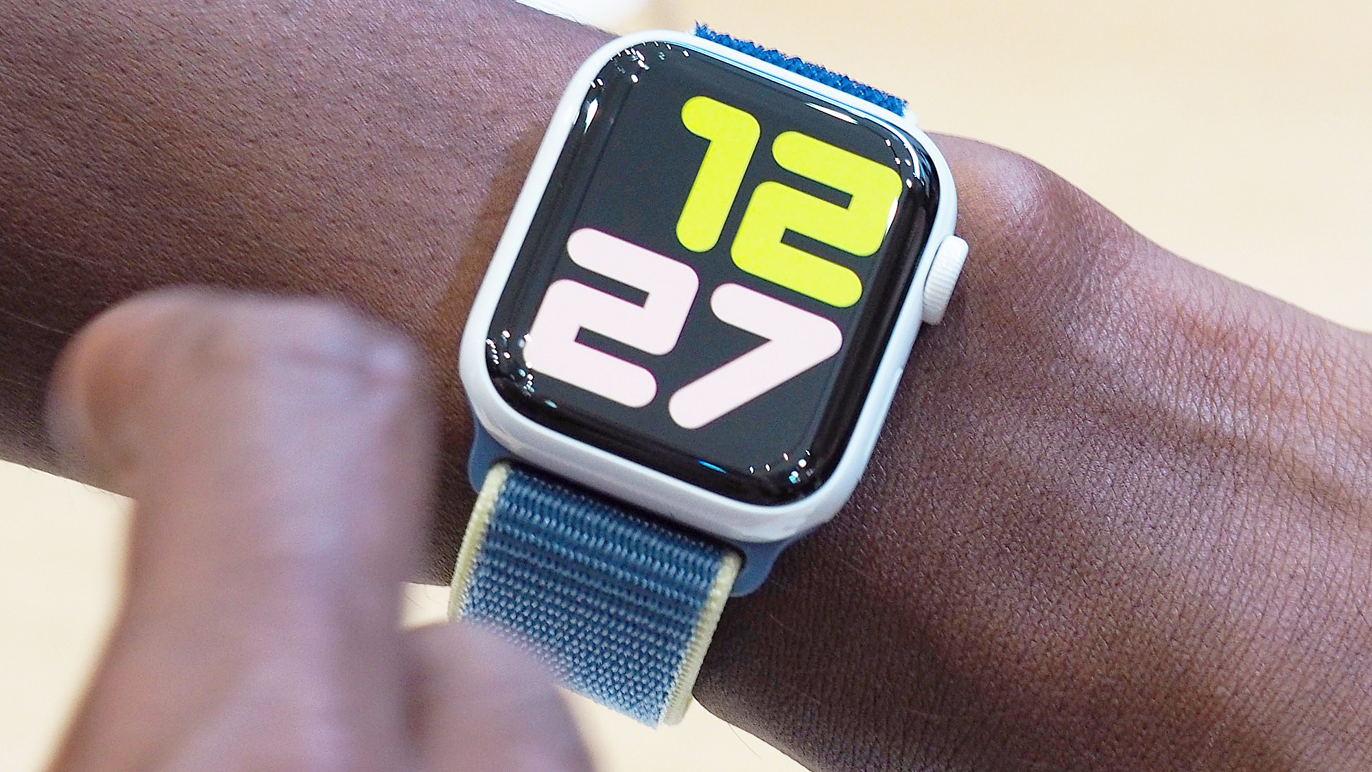 Close-up of the Apple Watch Series 5 in white ceramic on a user's wrist