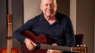 Mark Knopfler poses with his Boswell 0-14