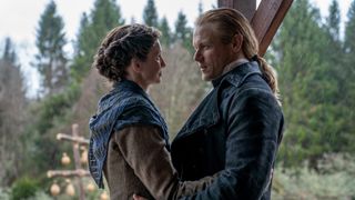 A still from Outlander Season 8 showing Claire (Caitr&iacute;ona Balfe) and Jamie (Sam Heughan)