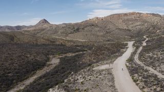 Colin Strickland rides his bike on the infamous "Road To Nowhere" in Pinto Canyon West Texas, USA on 6 April 2021.