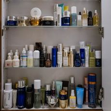 Photo of skincare products on a bathroom shelf